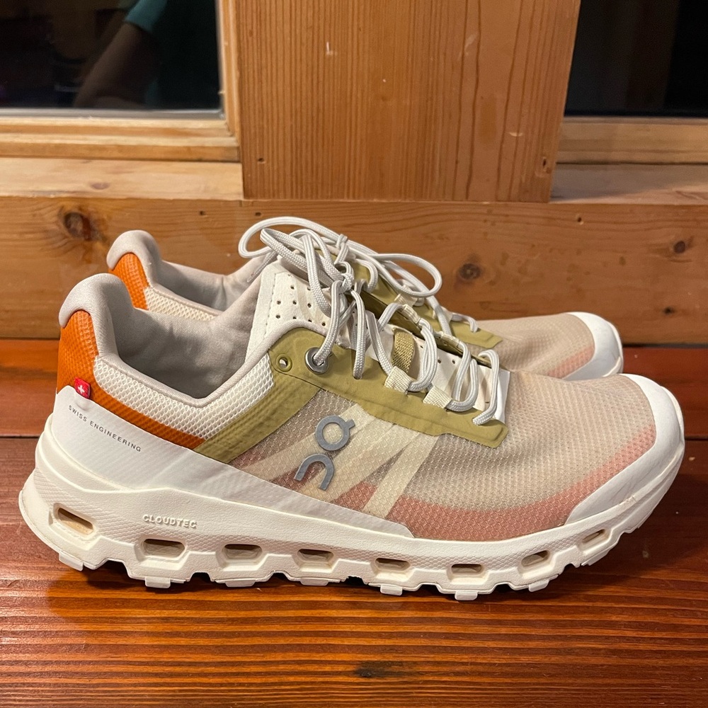 On Running Cream and Orange Athletic Shoes